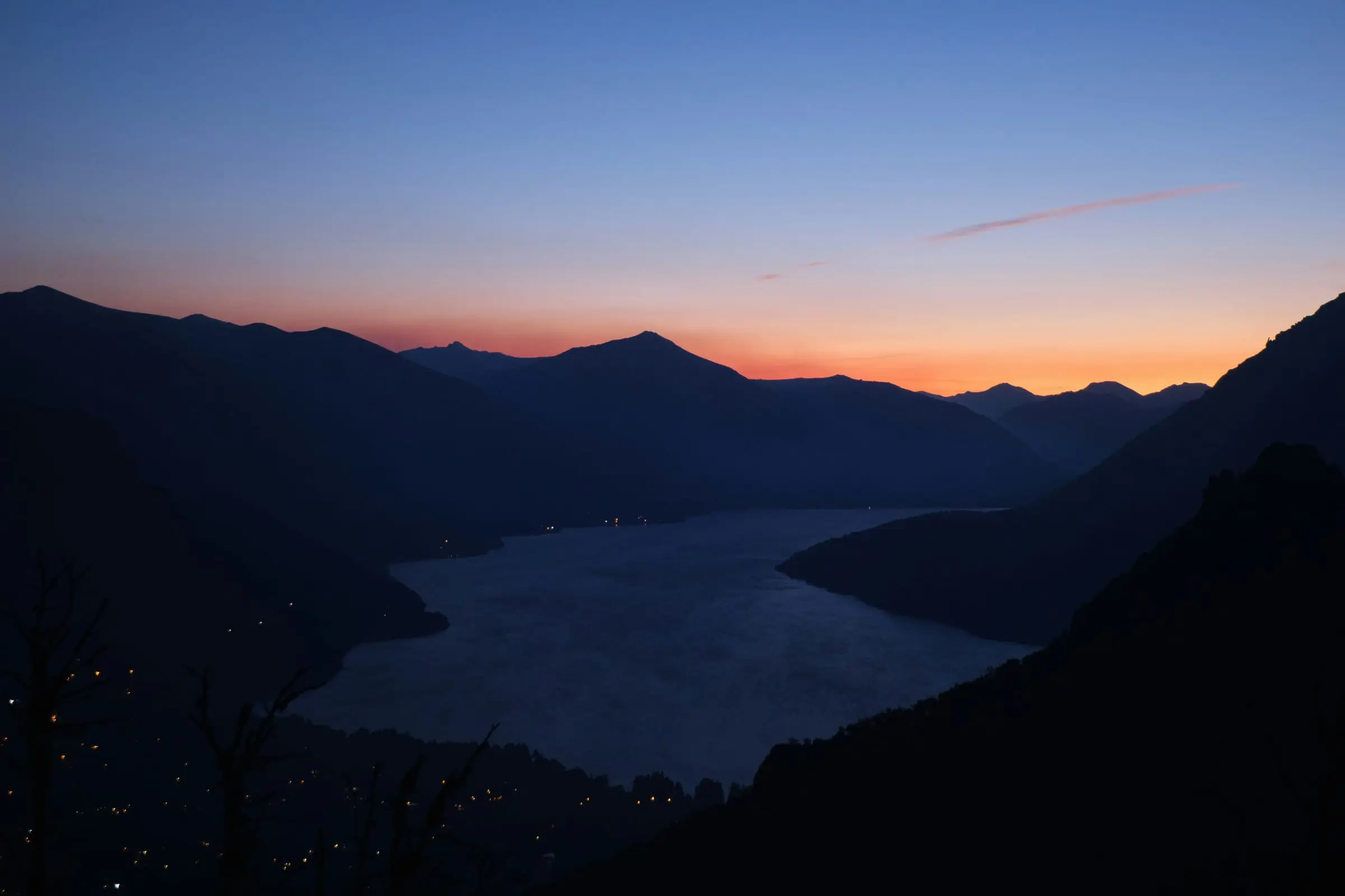 Bariloche mountain lake and silhouetted Andes at dusk