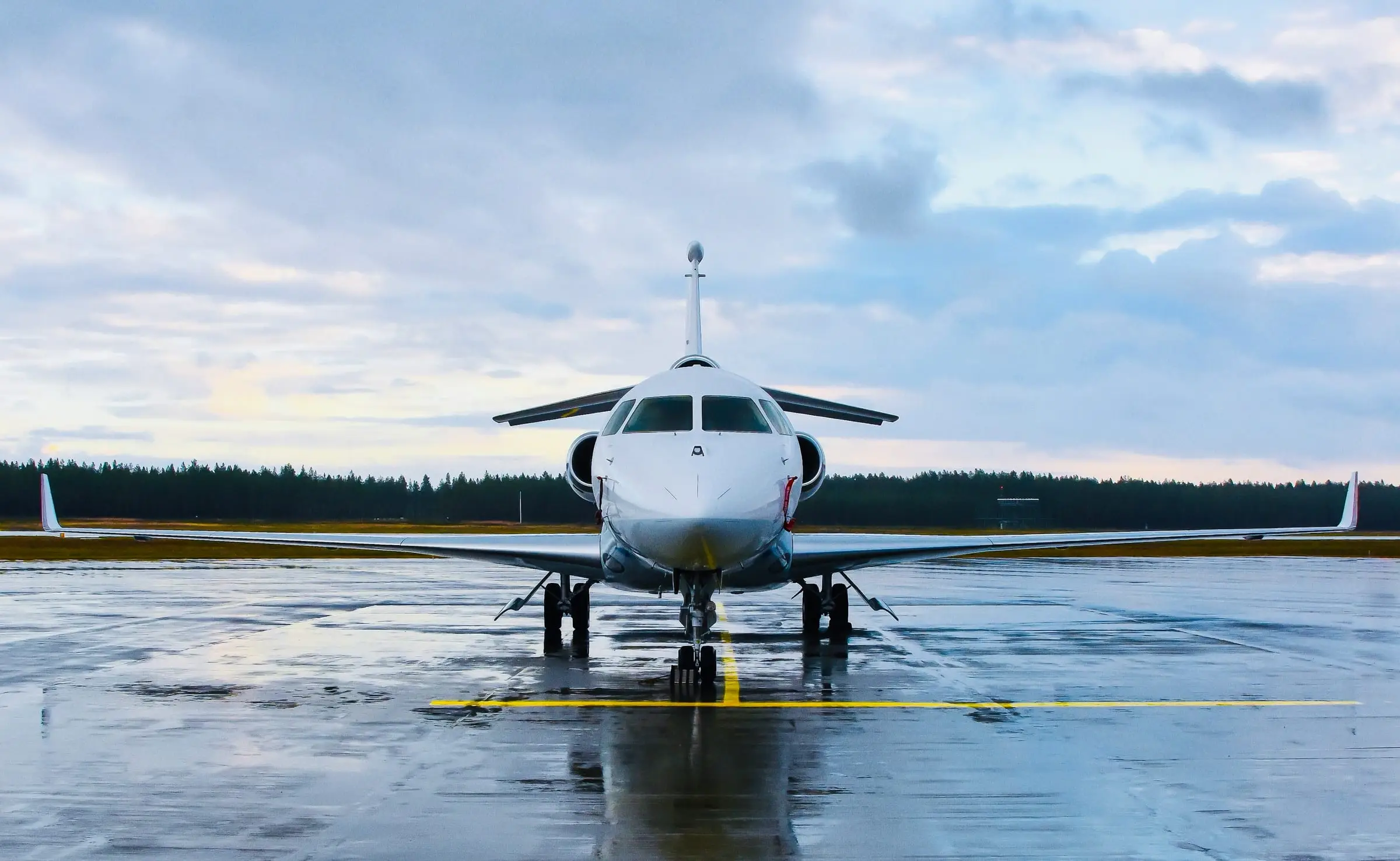 Private jet on wet airport apron