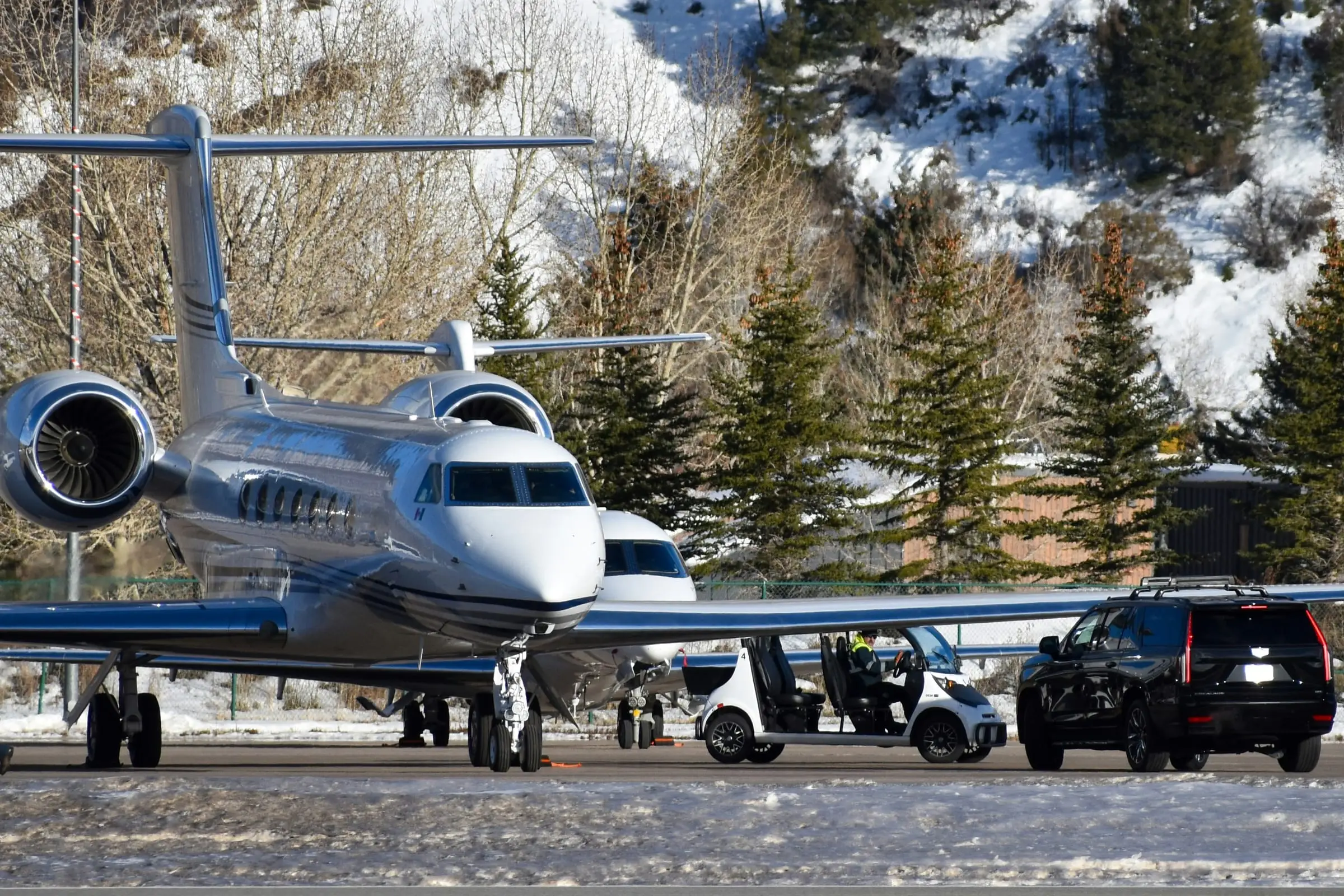 Large-cabin private jet on snowy apron